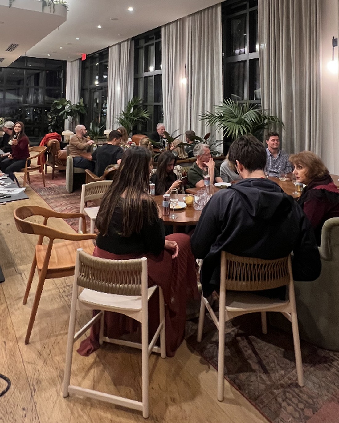 A room of guests seated at a private tasting.