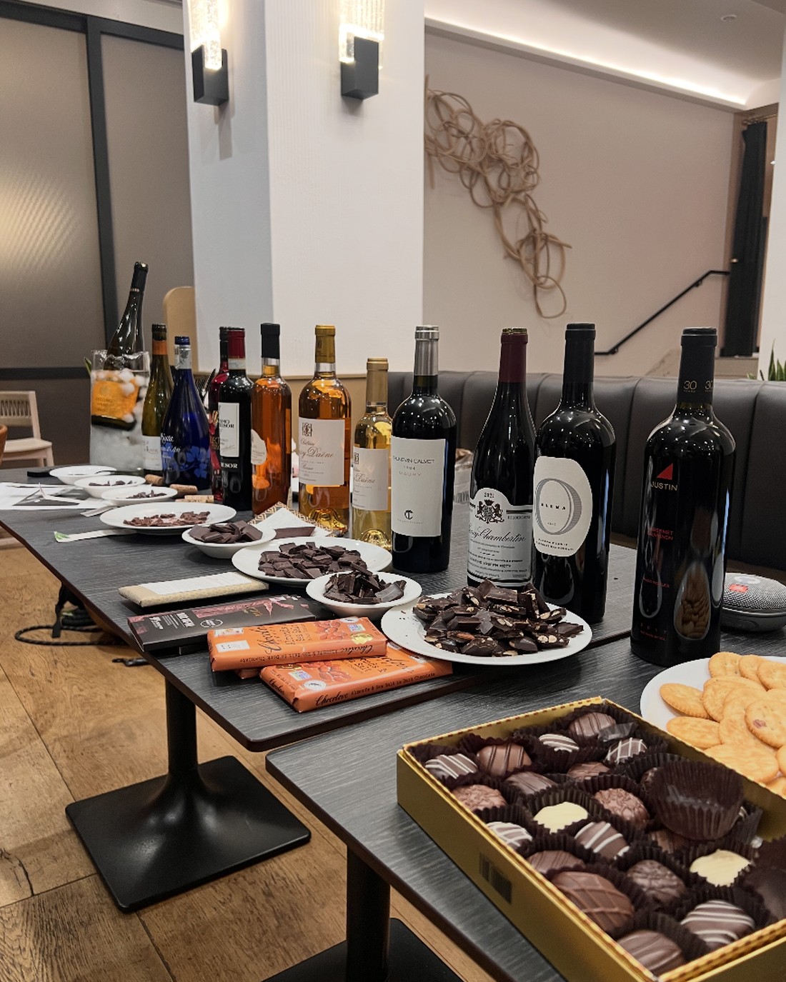 A dessert and cheese spread alongside reds from a seated tasting.