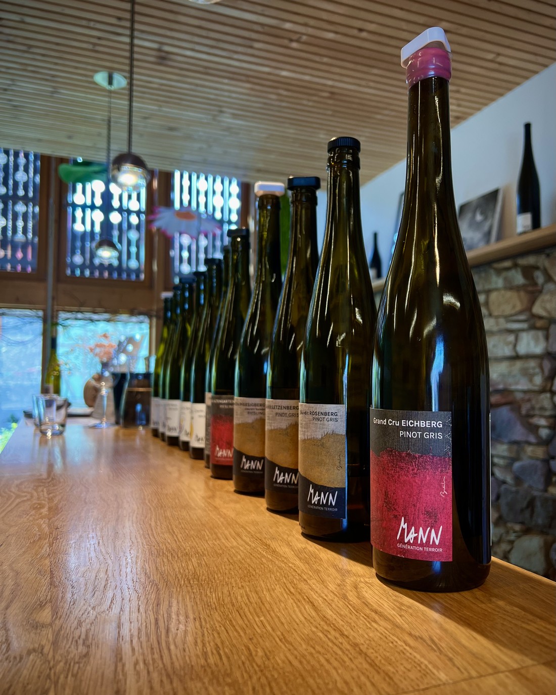 Mann Grand Cru Eichberg Pinot Gris leading a lineup of Alsace bottles.